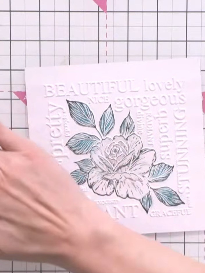 Step 5: Optionally, swipe a black ink pad over the waxed areas to add definition and make the embossed words stand out