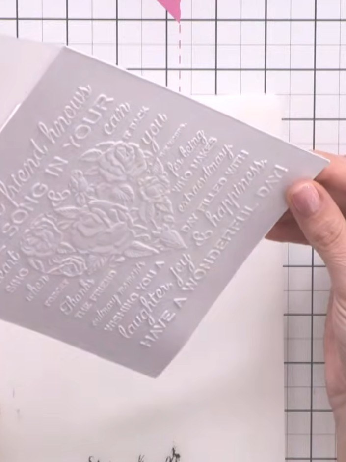 Step 1: Cut a piece of white card stock to size. Place it in the heart embossing folder and run it through your emboss