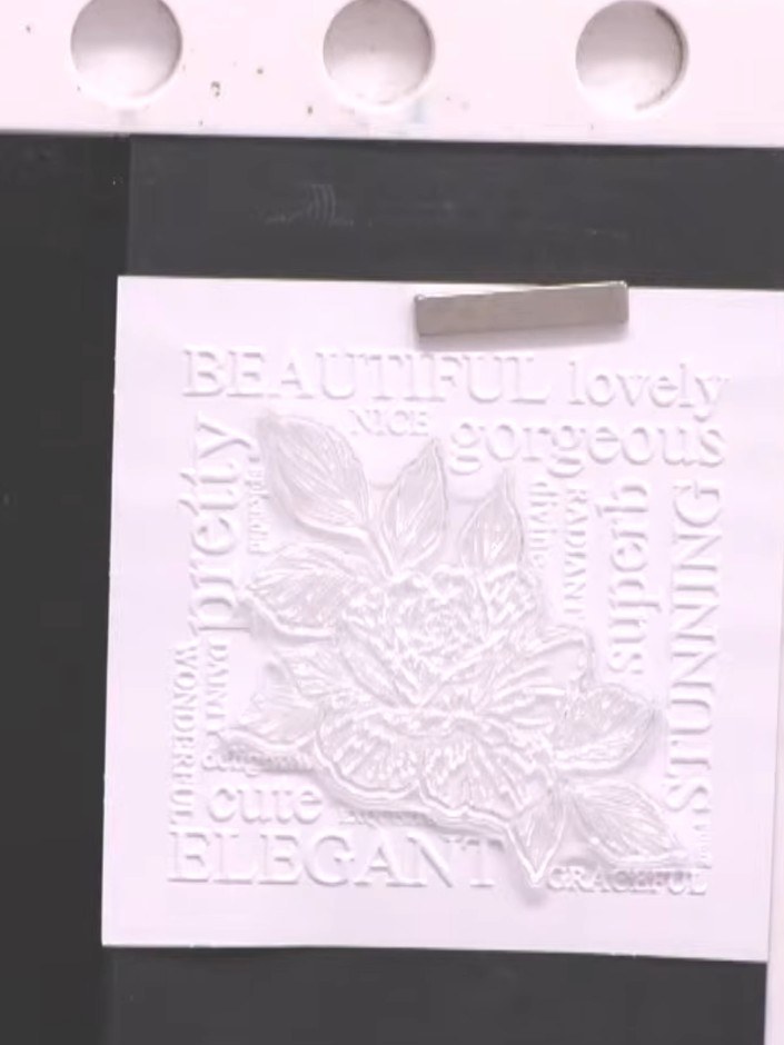 Step 4: Stamp over the embossed design again using black pigment ink to reinforce the words and floral details. Press 