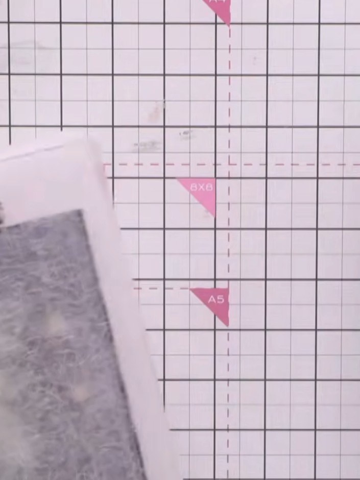 Step 4: Remove the embossed paper from the die-cutting machine and carefully open the embossing folder to reveal your 