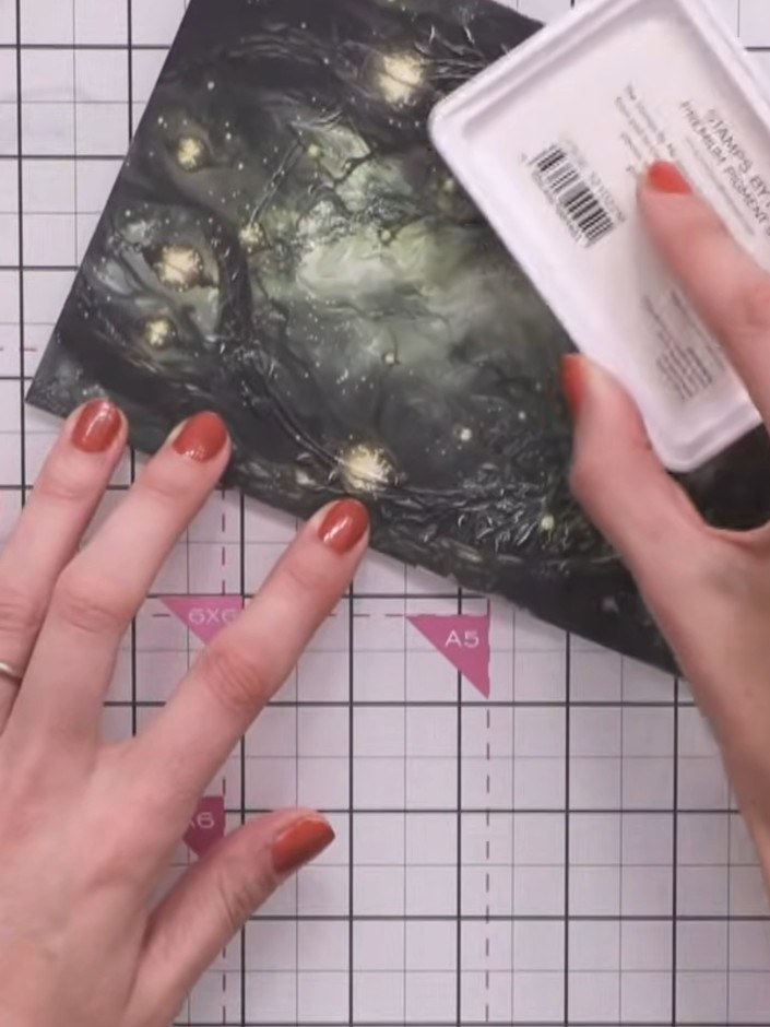 Step 6: Apply white ink to the fairy's face, body, and wings using the stamp pad. Tap the ink pad gently over these ar