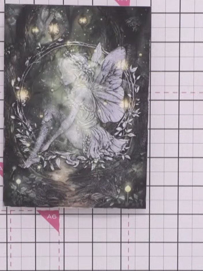 Step 7: Allow the embossed fairy image to dry completely. The white embossing ink will set, revealing the detailed fai