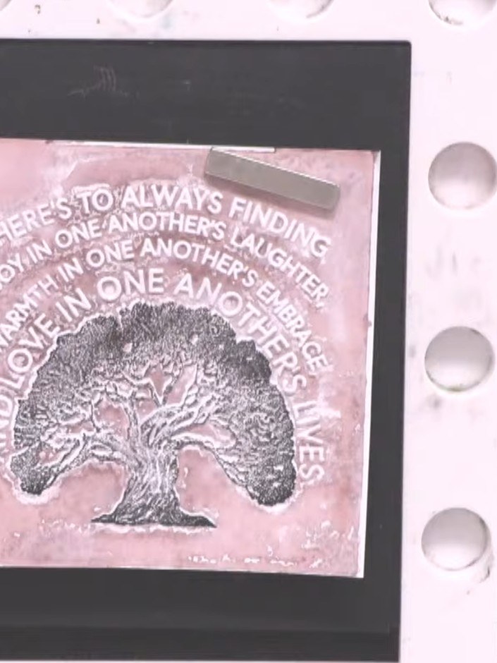 Step 1: Use a sponge dauber to ink the top portion of the tree stamp with green pigment ink. Apply the ink evenly acro