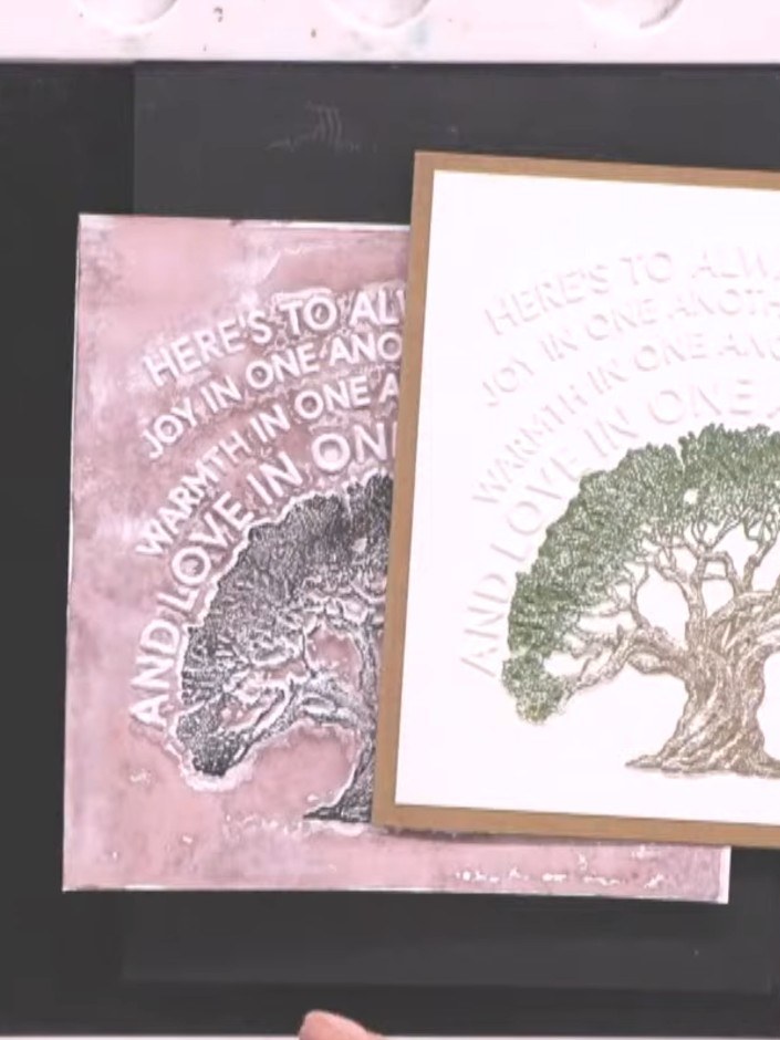 Step 4: Repeat stamping the tree design with the green ink across your white card panel, building up the multi-coloure
