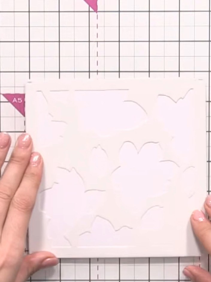 Step 2: Apply colour to the stencil using brushes and ink pads. Work with yellow, orange and pink inks for the flowers
