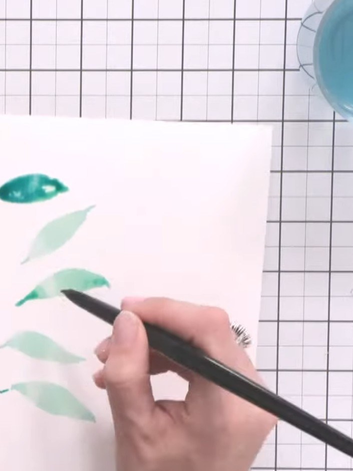 Step 5: Create variation by applying the toe-belly-toe motion twice on a single leaf shape using teal ink. This create