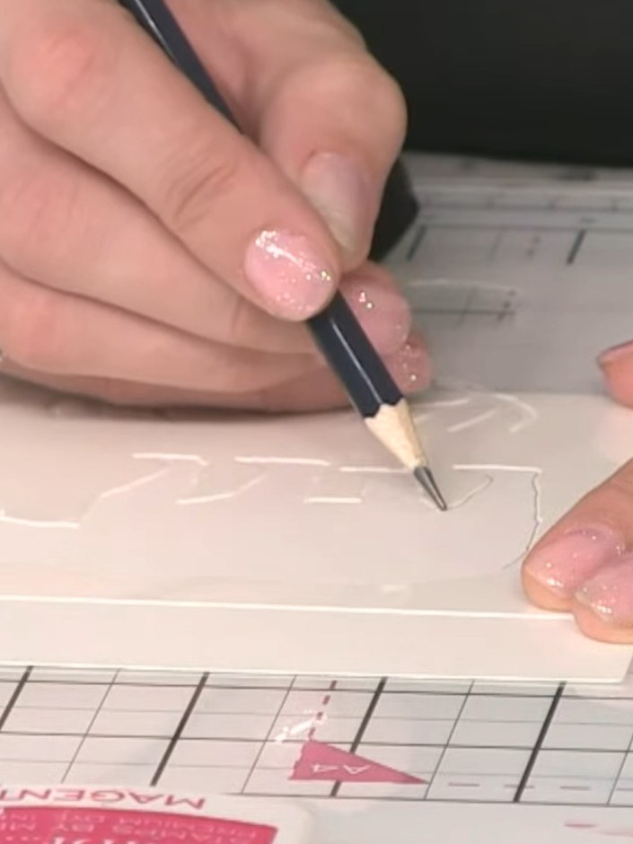 Step 2: Use a pencil to trace around the inside of the bear stencil to create an outline on your watercolour paper. Ho