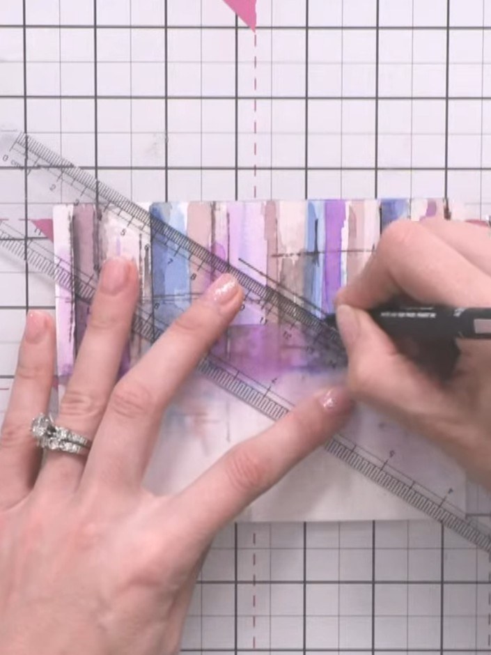 Step 10: Using the fine liner pen, add crane details and extra structural lines to your cityscape. Draw diagonal lines 