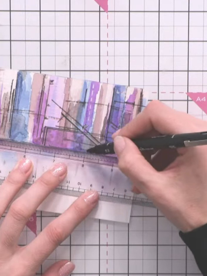 Step 12: Using a fine liner pen and a ruler, draw a broken horizontal line across the base of the buildings to ground t