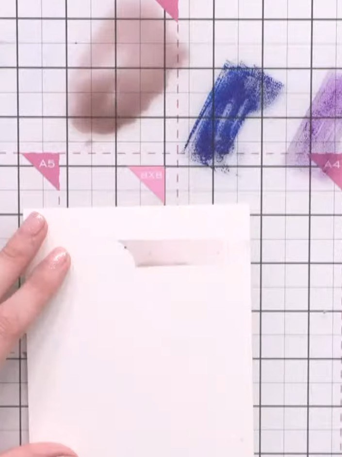 Step 5: Turn the card around and add purple ink lines at different levels across the background to create depth and va