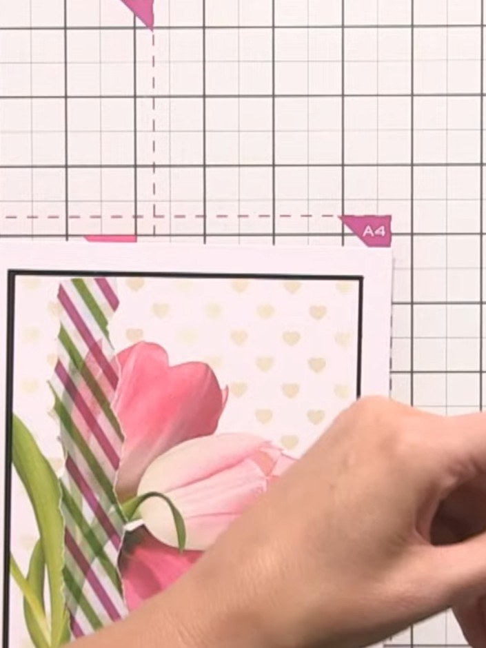 Step 7: Tie a delicate bow using twine or ribbon and position it on the right side of the card where the tulip stems m