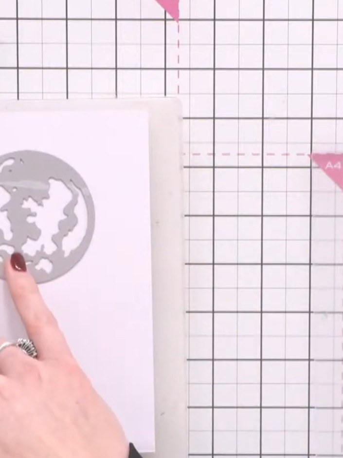 Step 1: Cut a moon shape from white card using the circular moon die from the Moonlit Skies die set.
