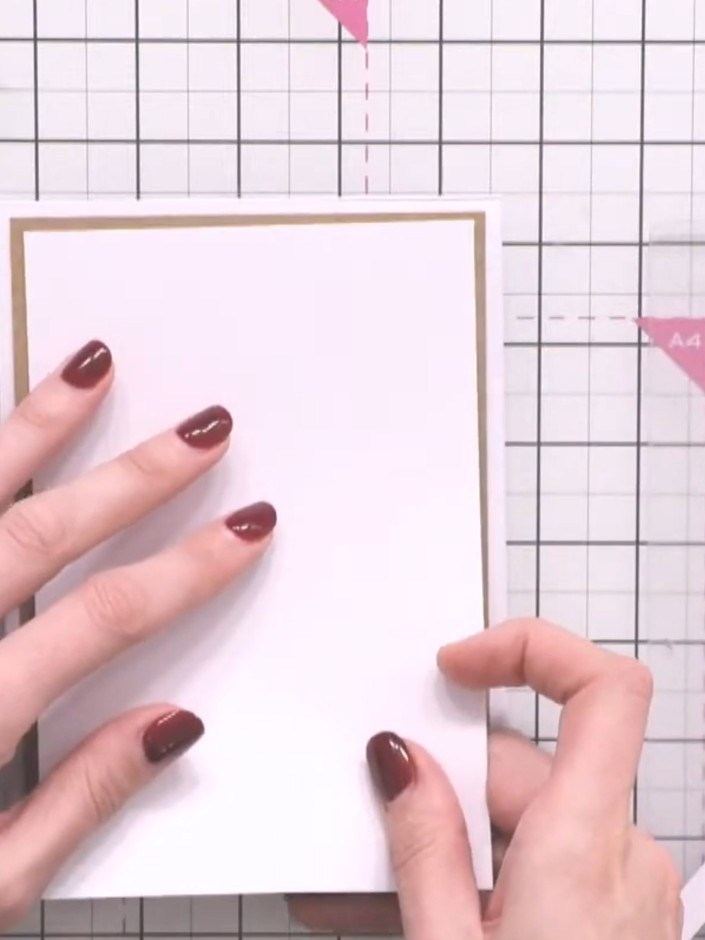 Step 2: Take a white card blank and position it on your craft mat as the base for your background panel.