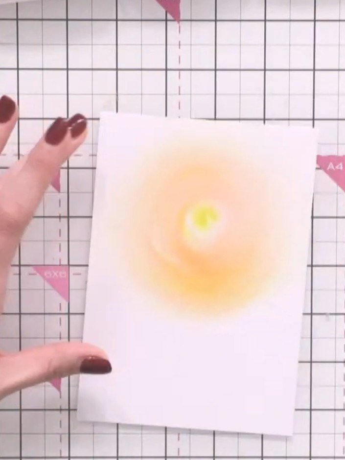 Step 5: Using the pink ink pad, add pink ink to the middle tones of your sunset blend, working it into the transition 