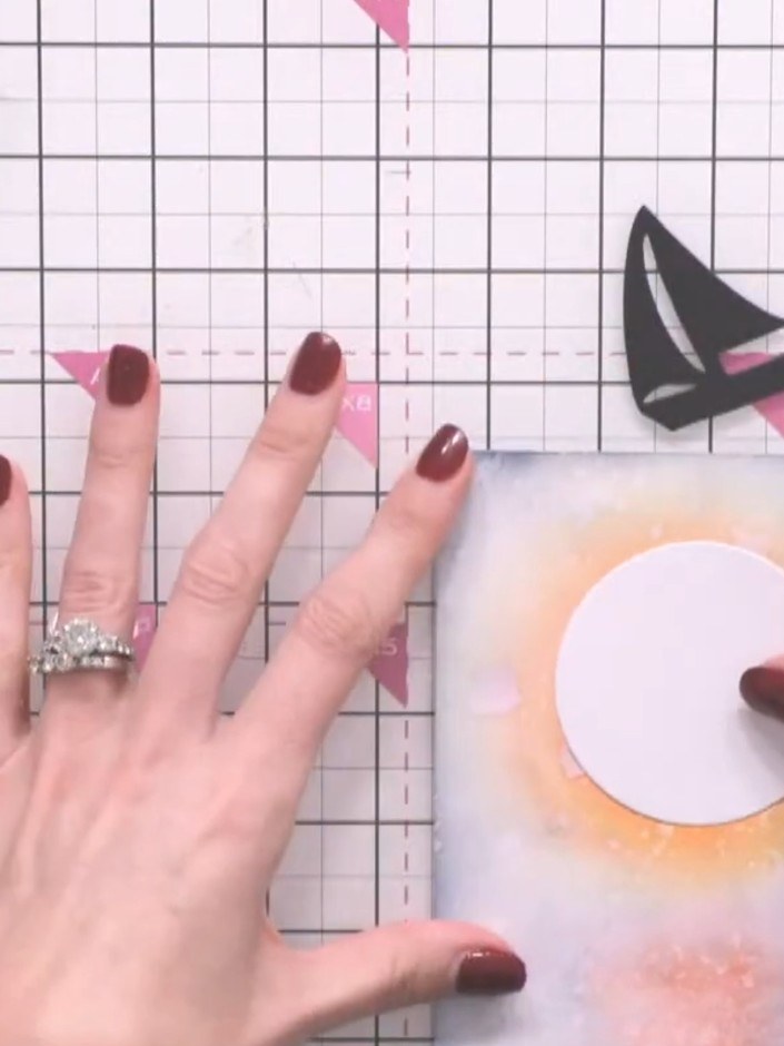 Step 9: Add yellow and orange ink directly to the white moon die-cut to create dimension and enhance the moon's appear