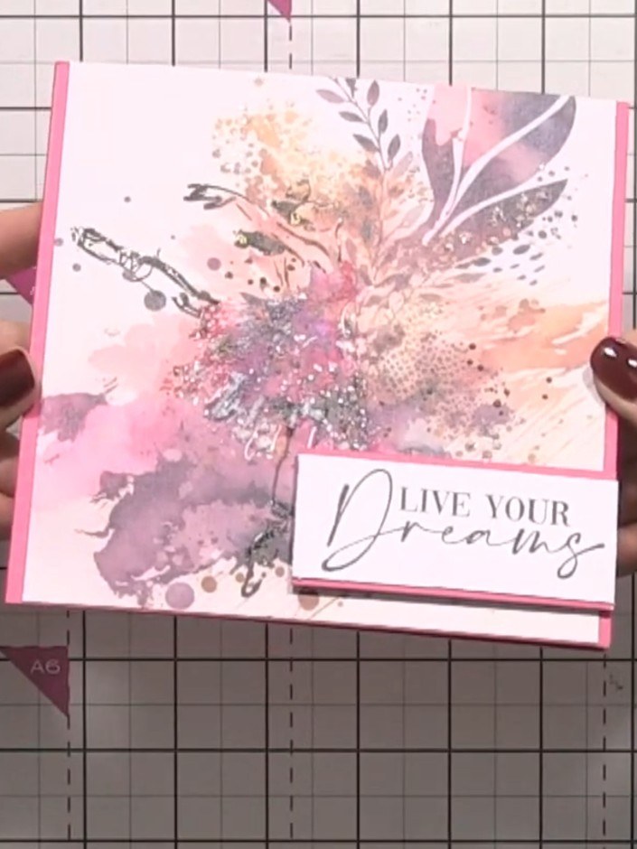 Step 11: Mount the finished design onto a pink card blank using adhesive foam pads to create dimension.