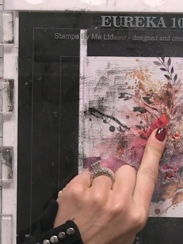 Step 5: Spray the inked area with water and use your finger to blend the colours, allowing them to spread and puddle a