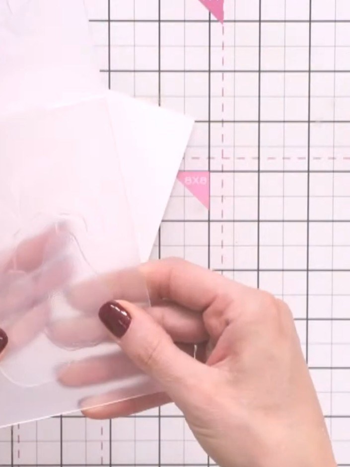 Step 1: Place your watercolour card into the pear embossing folder. Run the folder through your die-cutting machine to