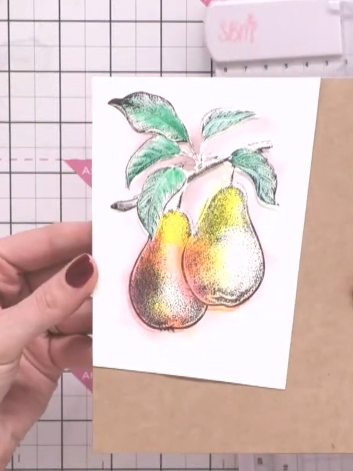 Step 10: Cut a strip from the painted card at an angle using a guillotine to create a diagonal design element for your 