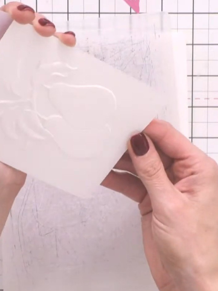 Step 2: Using a clean watercolour brush, wet the entire embossed pear area with clean water. Ensure the water covers a