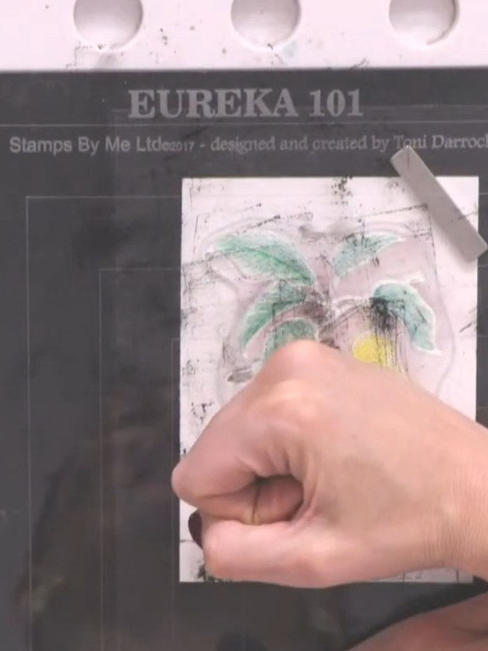 Step 7: Stamp the pear design over the watercoloured area using black ink to add fine detail and definition to the ima