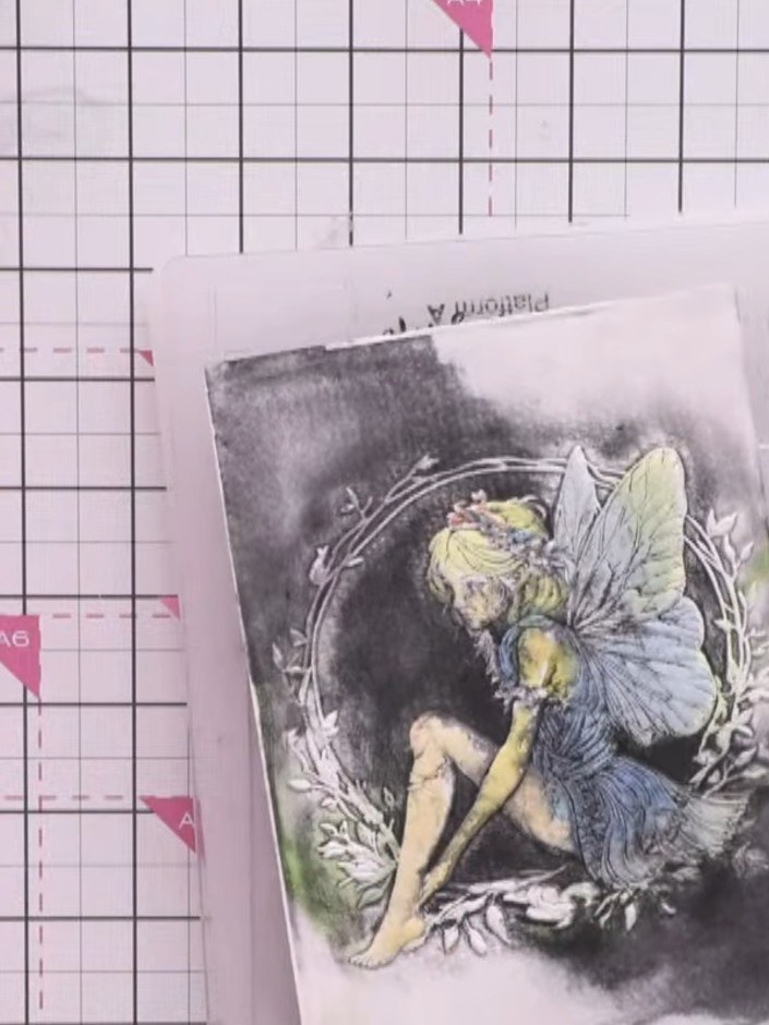 Step 12: If the fairy's face has become too dark, use a white ink pad to gently dab over the face area to lighten it an