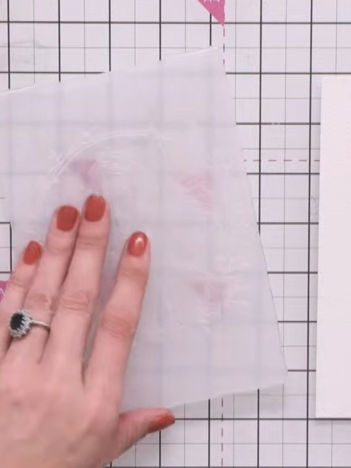 Step 7: Spray the card again with water. Run it back through the die-cutting machine, carefully lining up the fairy de