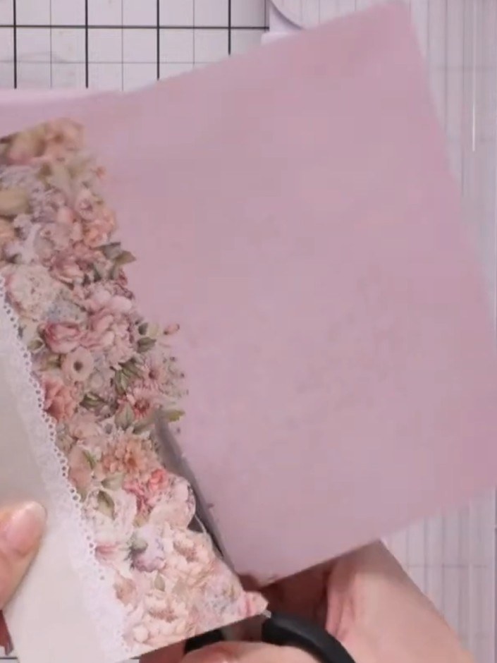 Step 3: Roughly cut out a decorative floral paper element. Position it behind the vellum fold to create a feature pane