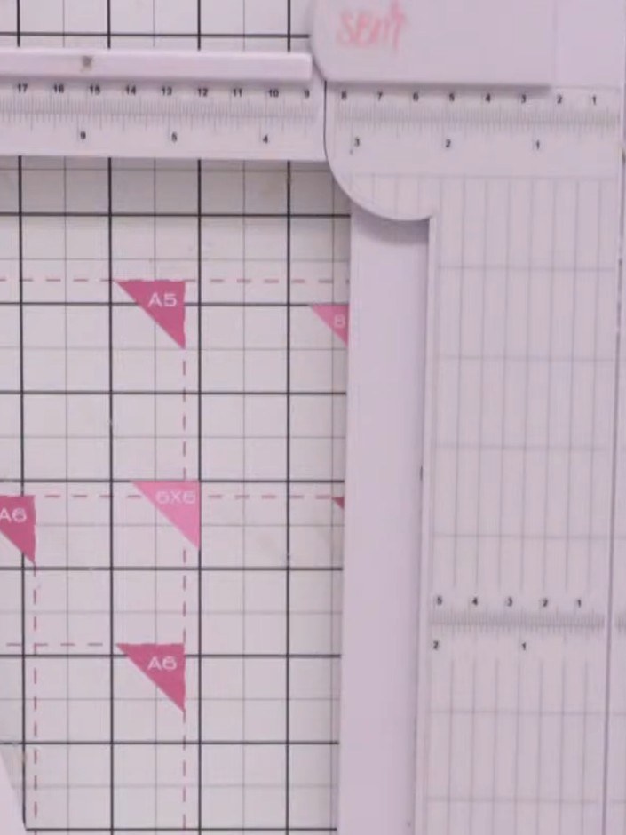 Step 1: Cut four strips of coordinating paper, each measuring one inch (2.5 cm) wide. Use a paper trimmer or ruler and