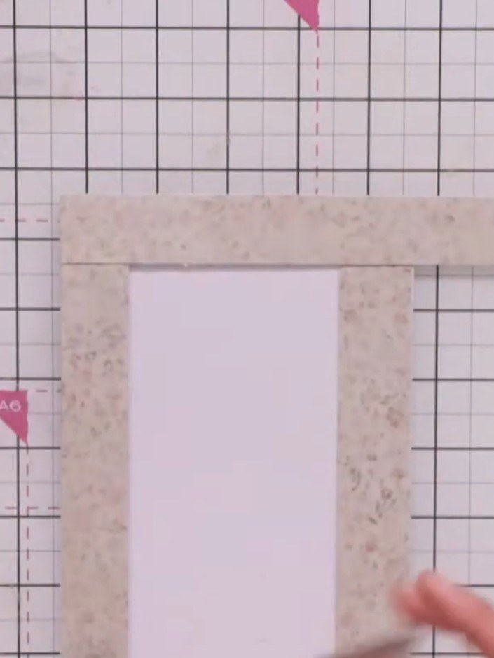 Step 4: Place the third decorative strip across the top of the card frame, overlapping the two side strips. Secure in 