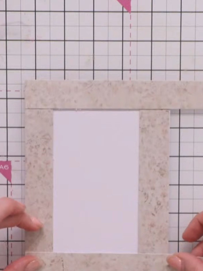 Step 5: Position the fourth strip across the bottom of the frame, overlapping all other strips, and secure with tape. 