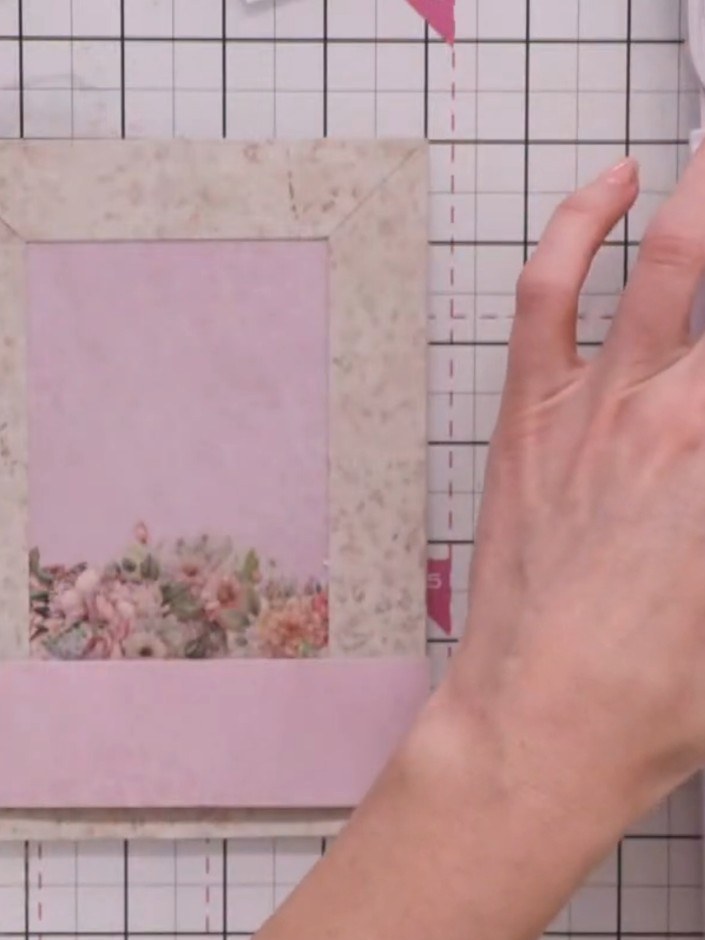 Step 4: Cut a second panel measuring one inch (2.5 cm) in height from a contrasting patterned paper. Position this pan