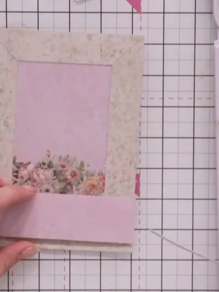 Step 6: Adhere the fussy-cut teacup element to the middle panel using foam pads for dimension.