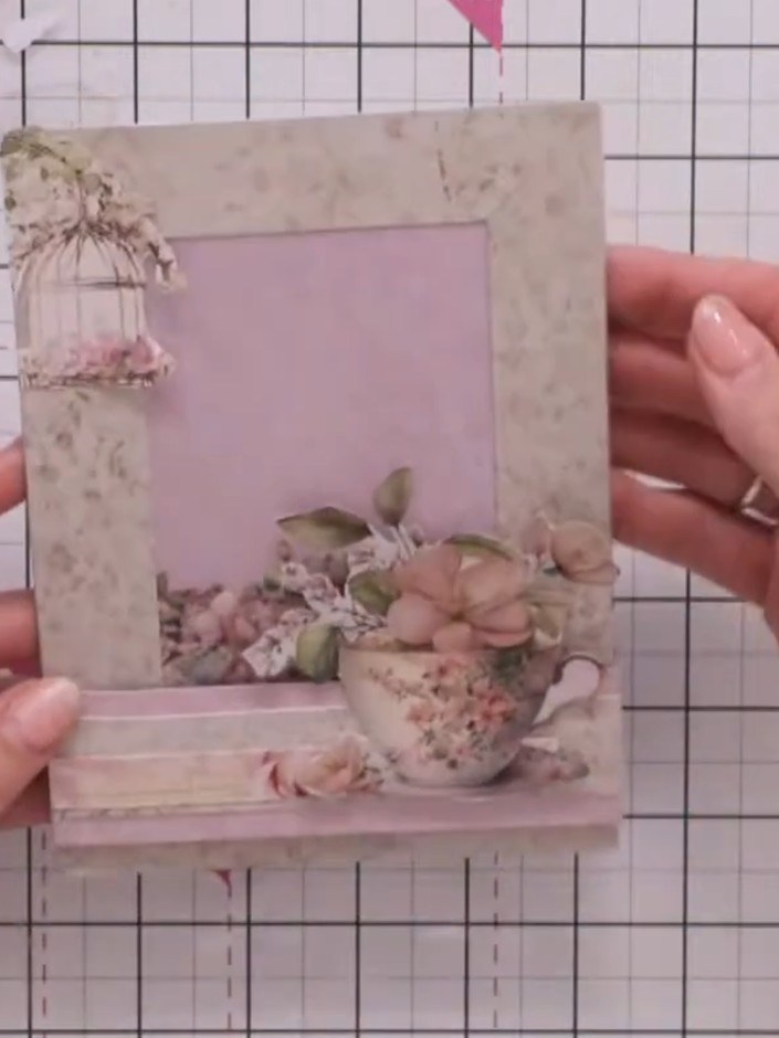Step 8: Hold the completed card and carefully trim away any excess paper from around the decorative elements to neaten