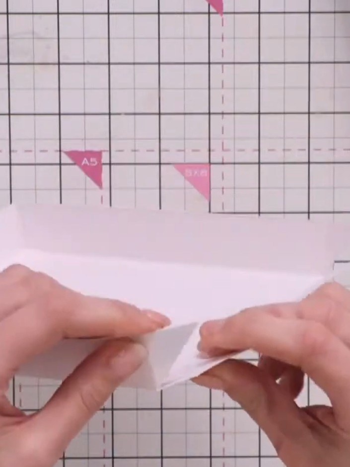 Step 10: Fold up all four sides of the box. Secure the interior flaps with tape to hold the sides in place.