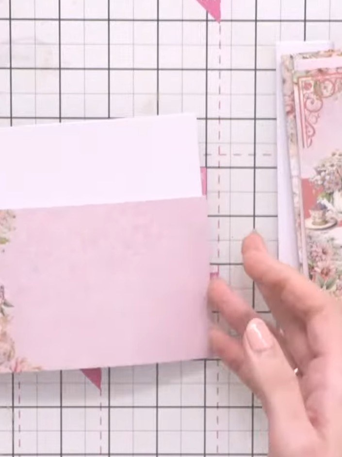 Step 1: Cut a coloured paper offcut to fit across the bottom of your landscape card base. Position it and secure it wi