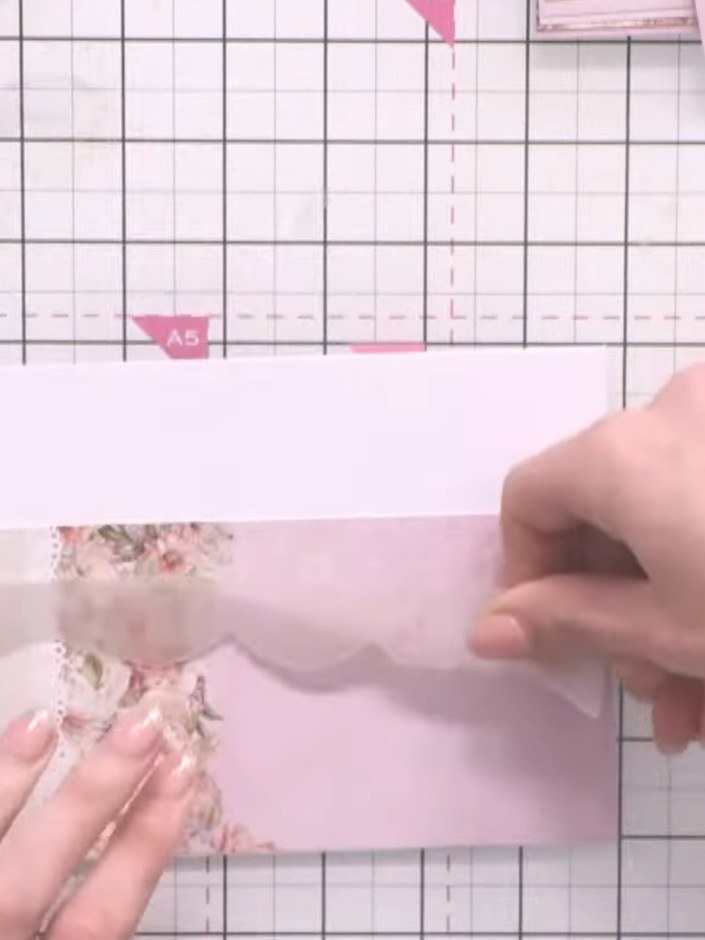 Step 3: Position a second strip of vellum above the first strip, overlapping slightly to create a layered texture effe