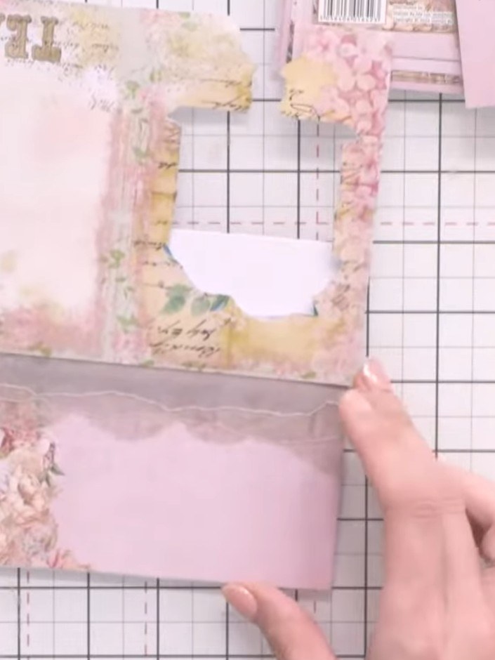 Step 5: Cut a thin strip of decorative paper from your paper collection. Position it horizontally across the middle of