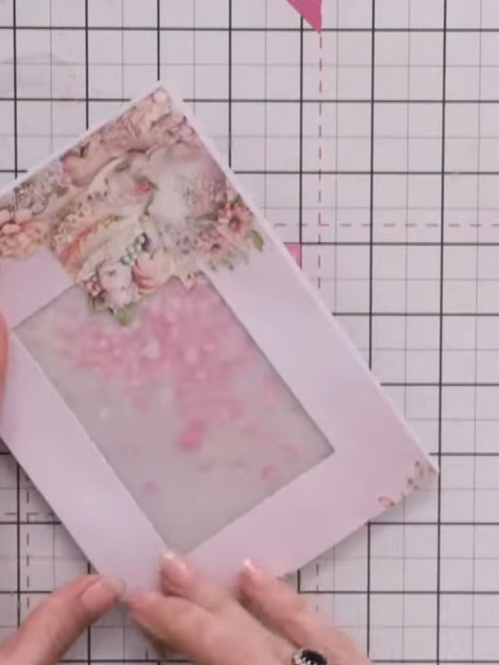 Step 10: Mount the decorated vellum panel onto a white matting layer using adhesive. Then attach this mounted panel to 