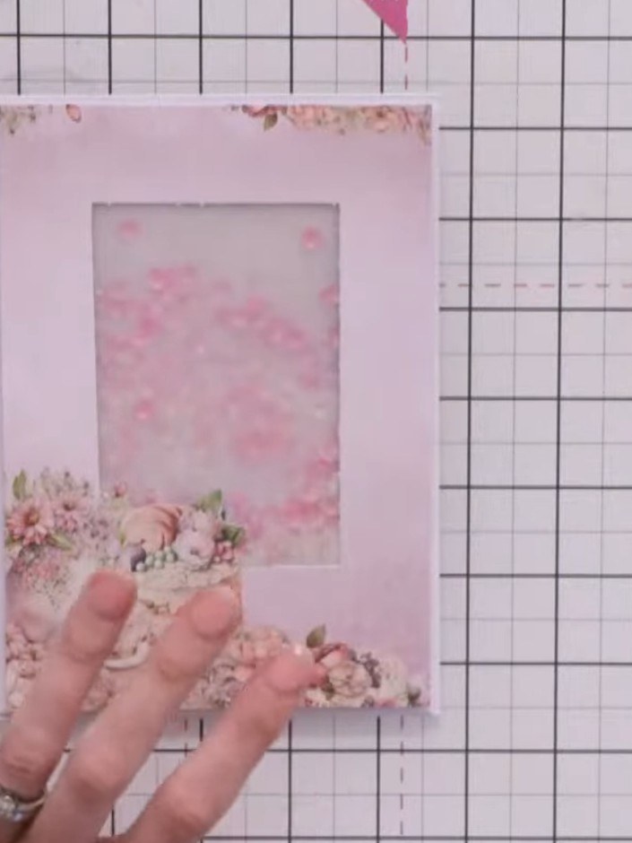 Step 11: Fussy-cut flower designs from your paper collection. Add them to the top corner of the card using foam pads to