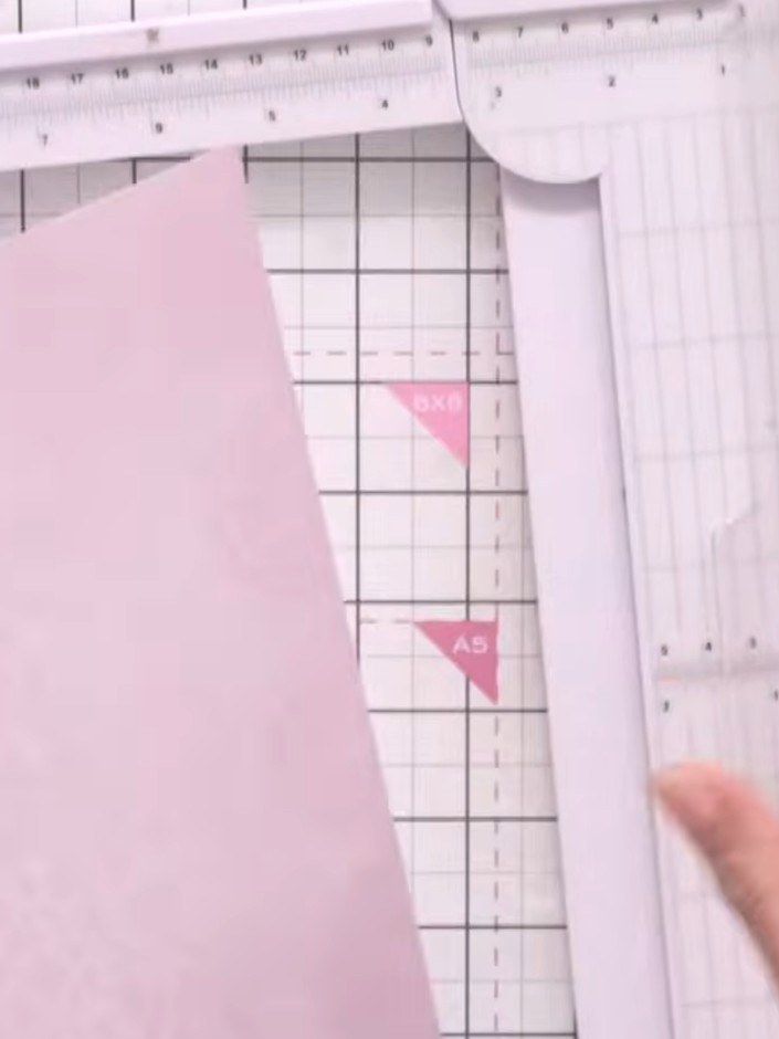 Step 1: Take a 12 by 12 inch sheet of paper and score it at 4 inches and 8 inches to create three equal panels.
