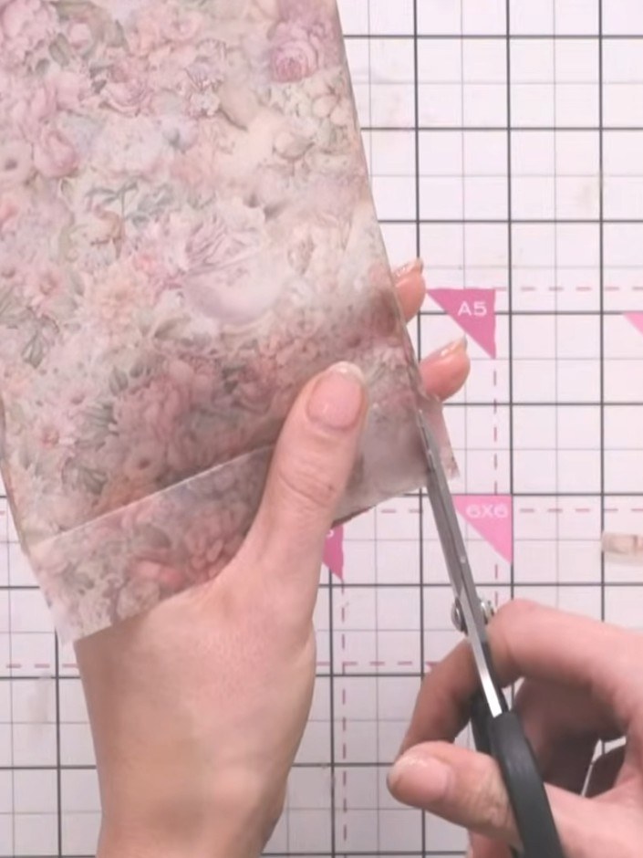Step 10: Use scissors to trim away the bulk from the bottom corners of the vellum backing. This reduces thickness at th