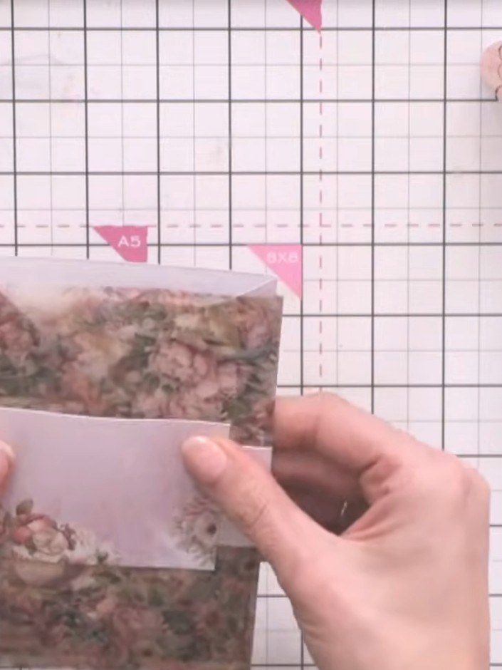 Step 13: Fussy cut a decorative element from the patterned paper and layer it onto a small grey paper panel. Adhere the