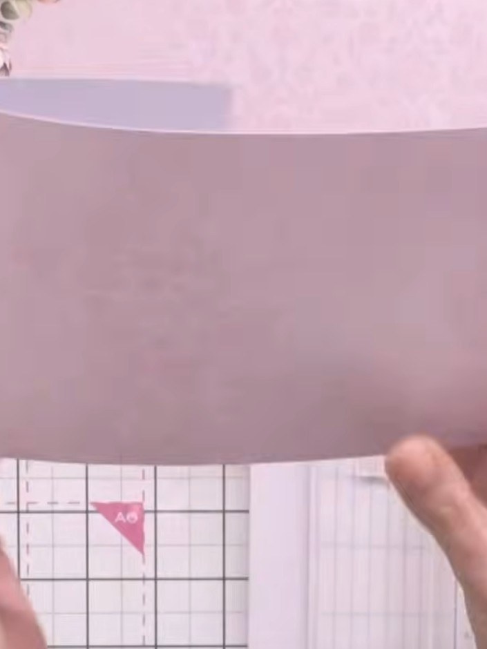 Step 2: Cut the scored sheet in half horizontally along the centre score line to create two separate pieces.