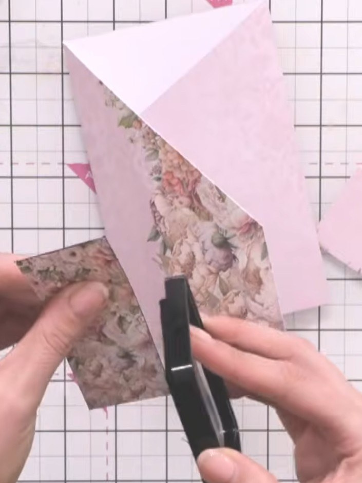 Step 5: Use black ink to edge the pocket openings on the floral patterned piece. This will define the openings and pre