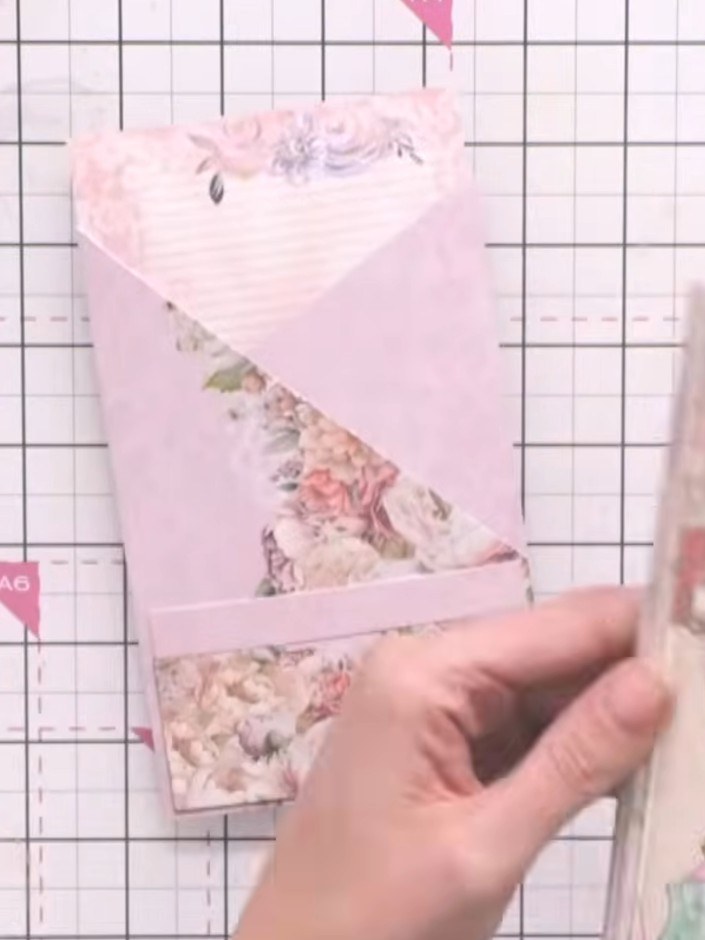 Step 7: Fussy cut decorative embellishments from the patterned papers in the collection. Slot the cut-out images into 