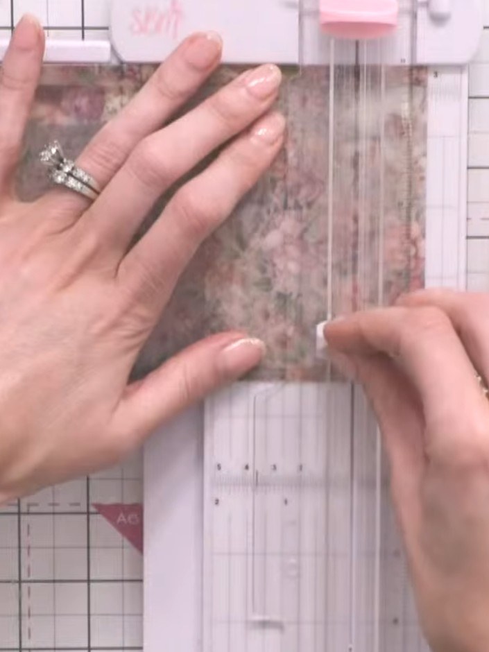 Step 9: Score the vellum at the bottom edge to create a flap. Cut a backing piece from patterned paper to fit the scor