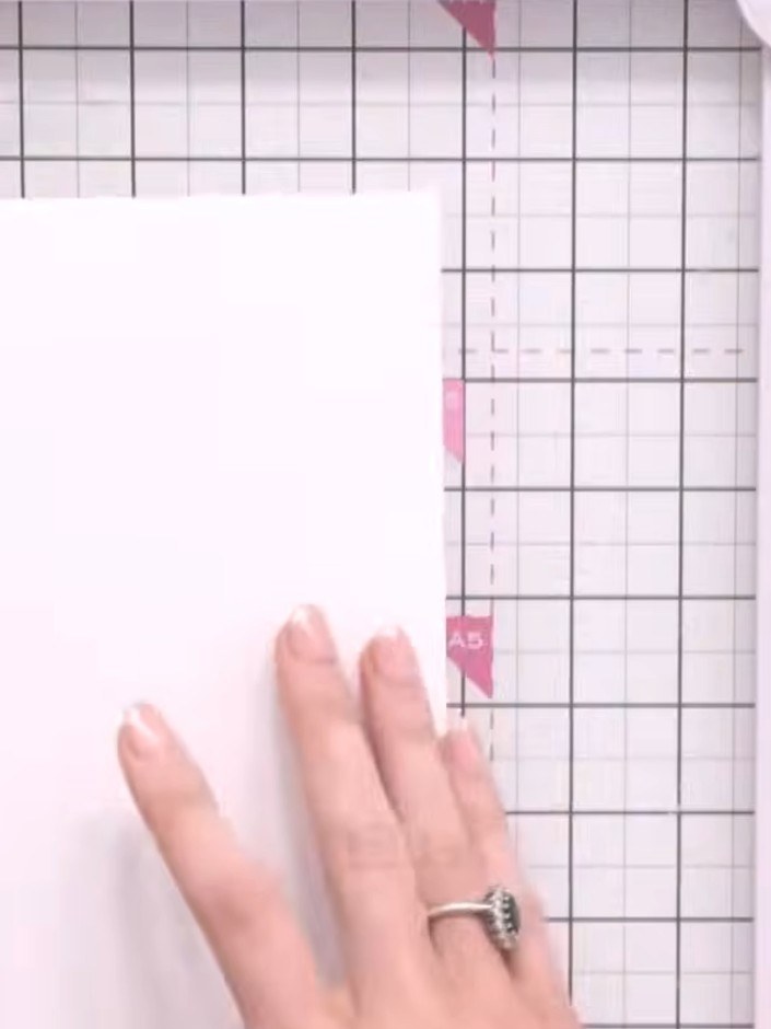 Step 1: Cut a piece of white card stock to 30 cm long. Score at 10 cm and 20 cm to create three equal panels for your 