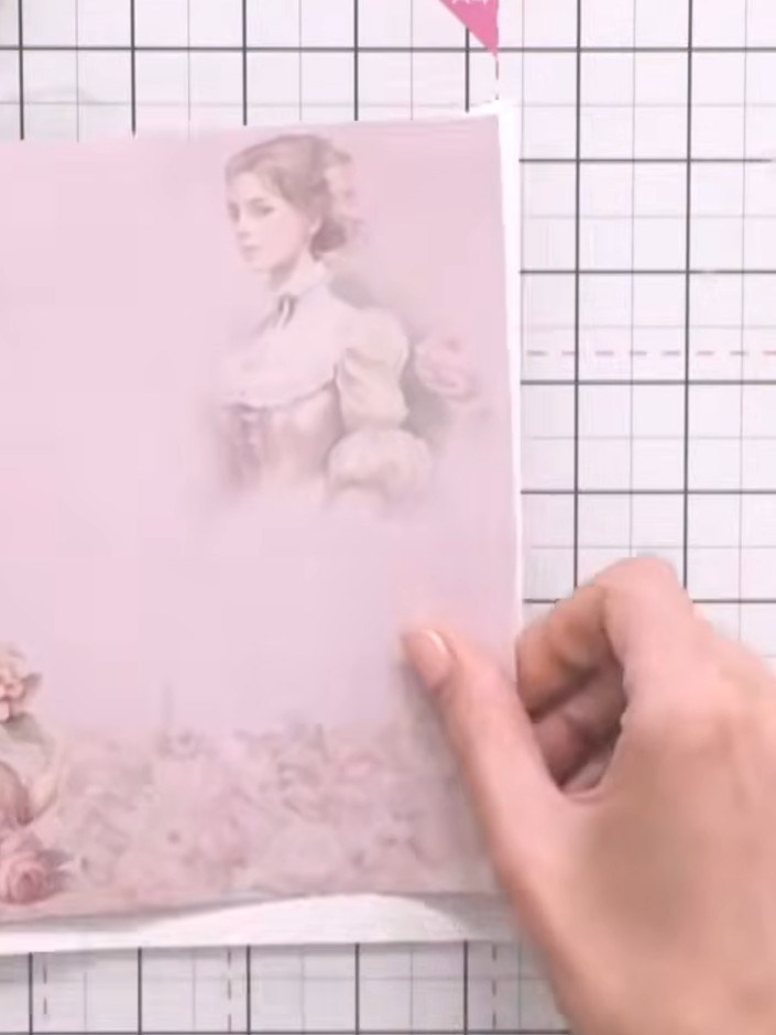 Step 5: Cut each decorative paper panel slightly smaller than the card panel size, approximately 9.5 cm, to create a w