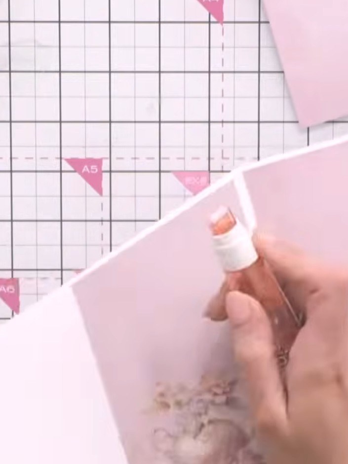Step 9: Attach the fussy-cut lady figure to the front of the card using foam pads to add dimension.
